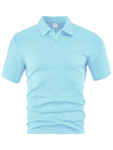 Macro shot of light blue polo shirt featuring textured waffle knit fabric and button collar