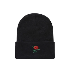 Black knitted beanie hat with red rose embroidery on the fold, streetwear style for winter