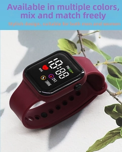 Detail view of burgundy LED sports watch showing step counter and heart rate monitor