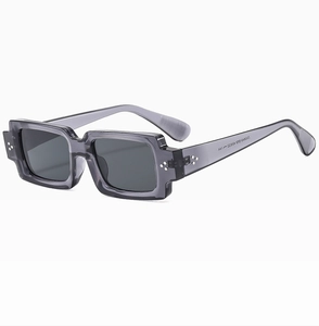 Detailed close-up of gray translucent rectangular frames with dark black tinted lenses