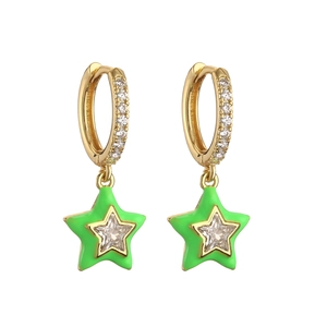 Detailed shot of gold hoop earrings with green enamel stars and cubic zirconia stones