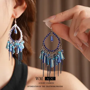Orecchini bohémien in argento con perline blu e nappe a catena metallica in stile vintage