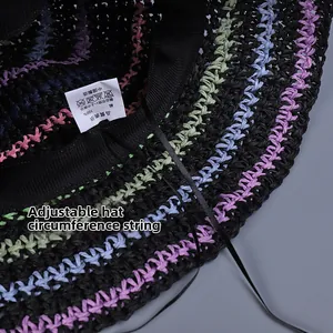 Detail of crochet straw hat showing inner adjustable strap and washing label info
