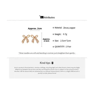 Detailed view of zircon bow earrings with S925 silver needles and dimensions 2.5cm by 2cm