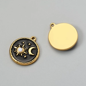 Detail view showing front and back of gold tarot pendant with black enamel sun and moon