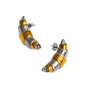 Modern two-tone gold and silver crescent stud earrings with a polished metal finish