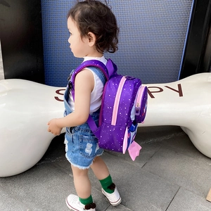 Toddler safety backpack in purple with white stars and decorative pink wings detail