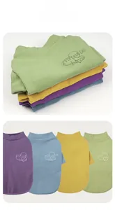 Detailed embroidery of infinite love on colorful ribbed knit dog sweaters in four shades