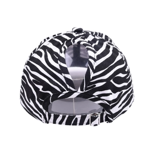 Detail of zebra print ponytail baseball cap with crisscross back and adjustable metal buckle