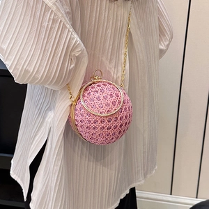 Pink spherical rhinestone evening bag with gold chain strap and ring handle