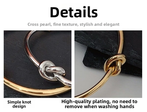 Detail view of gold and silver knot bangles featuring a high-polish metallic finish