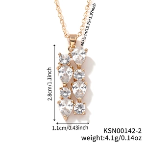 Detailed view of gold bar pendant with teardrop zircons and precise size measurements
