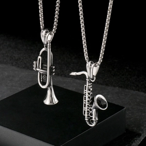 Polished stainless steel trumpet and saxophone skull pendants on box chains