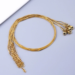 Detail of golden stainless steel snake chain necklaces with lobster clasps and extenders
