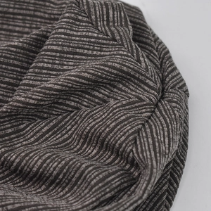 Brown and gray striped knit beanie hat for men and women featuring soft ribbed texture