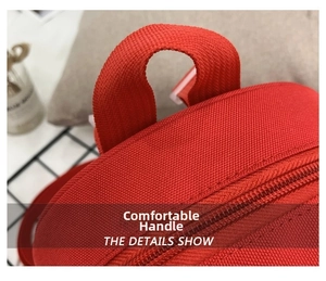 Close-up of comfortable red nylon handle and durable zipper on cute toddler backpack