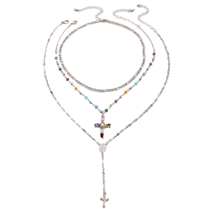 Detailed view of triple-layered silver necklace with rhinestone cross and colorful beads