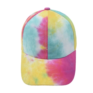 Close-up of vibrant tie-dye baseball cap with colorful pink, yellow, and blue canvas fabric