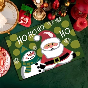 Mantel individual navideño con Papá Noel y estampado Ho Ho Ho en fondo verde