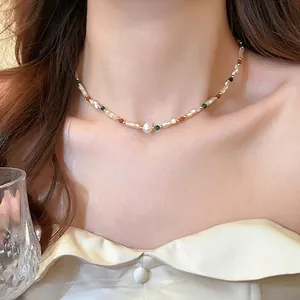 Elegant beaded baroque pearl necklace with colorful beads shown on model neckline