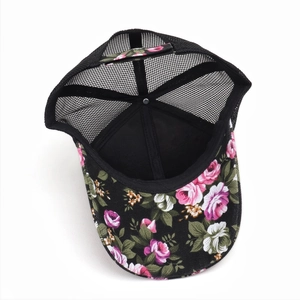 Breathable black mesh trucker hat with a colorful floral pattern printed on the canvas visor