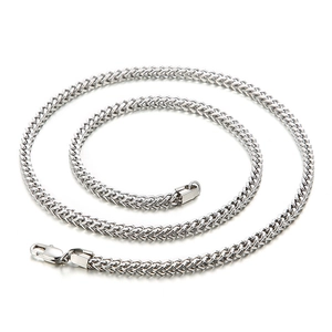 Polished silver stainless steel curb chain necklace for men on white background