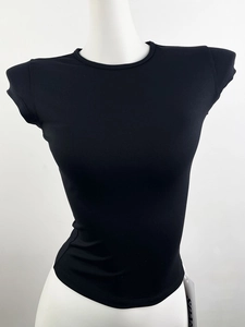 Detail of black slim fit athletic T-shirt with breathable fabric and short cap sleeves