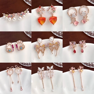 Elegant collection of zircon flower and butterfly earrings in various gold colors