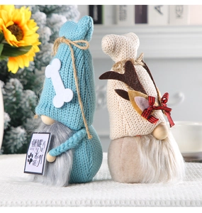 Detail of blue knitted Christmas gnome with wooden nose and Home is Where the dogs Are sign