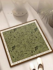 Detail of green diatomite bath mat with floral art and anti-slip texture for bathroom