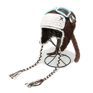 Handmade crochet pilot knit hat with blue goggles and braided tassels for kids