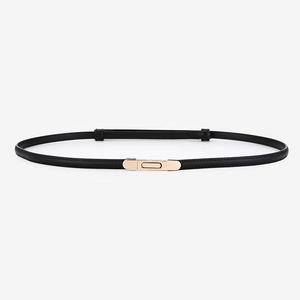 Minimalist black leather skinny belt with elegant gold rectangular buckle for women