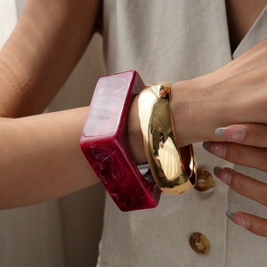 Acrylic marble resin bangle set with polished wide golden metallic bracelet for women