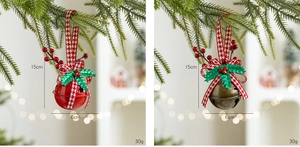Detailed comparison of red and bronze Christmas bell ornaments with ribbon and berry accents