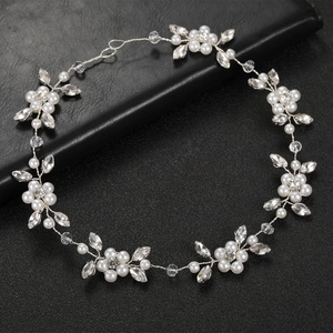 Elegant bridal hair vine with white pearls and crystals on silver wire for weddings