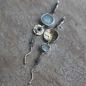 Asymmetric bohemian drop earrings with blue stone and cross accents in vintage metal