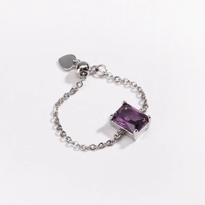 Detailed view of adjustable silver chain ring with purple rectangular gemstone and heart charm