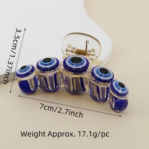 Blue Evil Eye hair claw clip made of acrylic with a gold spring mechanism, 7cm width