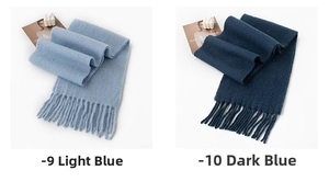 Detail of light water blue and deep navy cashmere-feel scarves with long fringe