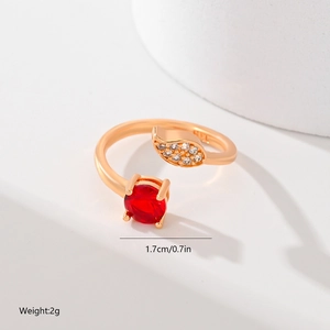 Adjustable gold leaf ring detail with red gemstone, tiny zircon stones and size markers