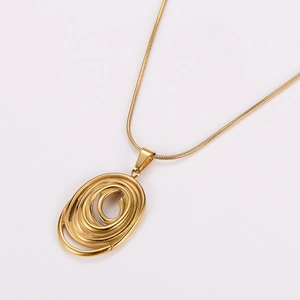 Exaggerated golden spiral oval necklace set featuring elegant metal finish on white base