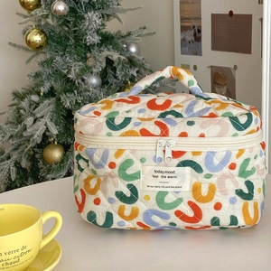 Bolsa de maquillaje de algodón acolchada con patrones coloridos y asa superior