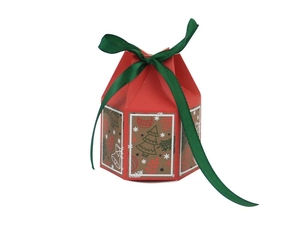 Macro view of Christmas gift box with red hexagonal design and festive patterns