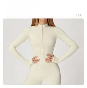 Close-up of cream yoga bodysuit featuring a front zipper and high elastic thermal fabric