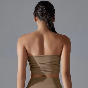 Detail view showing back design of solid color strapless sports bra with elastic fabric