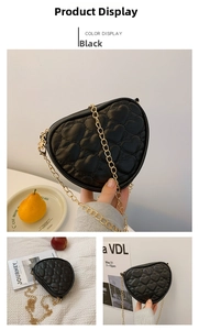Close-up of black heart-quilted crossbody bag with elegant gold chain strap for girls