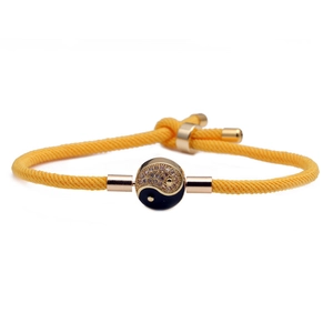 Yellow braided Milan rope bracelet with a gold-rimmed Yin Yang pendant and zircon inlay
