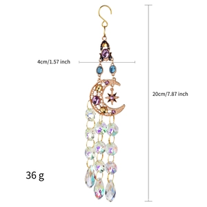 Detail view of crystal suncatcher with gold moon stars and product dimensions
