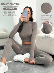 Detail of high-waist yoga pants with tummy control and 3D textured cable knit fabric