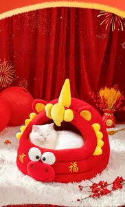 Detail of red dragon-shaped cat bed with plush lining for winter warmth and festive style